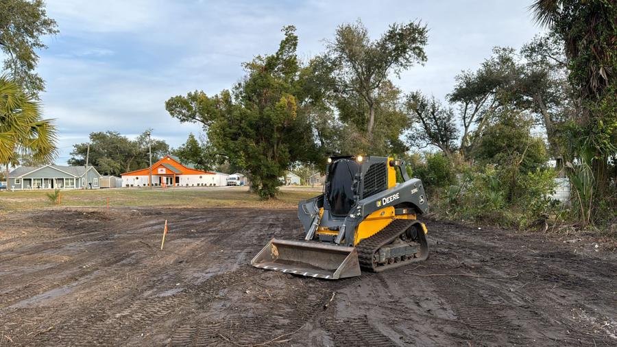 Bradberry Land Management track loader grading a staked lot