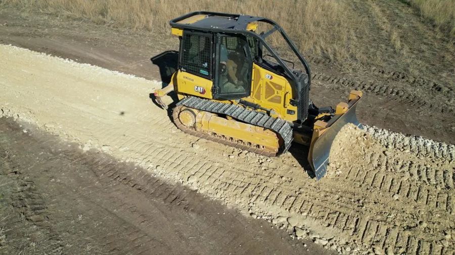 Bradberry Land Management dozer spreading fill on a job site